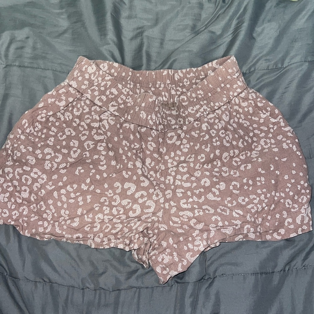 Brownish color shorts with cheetah print on it, size xs, brand is a new day
